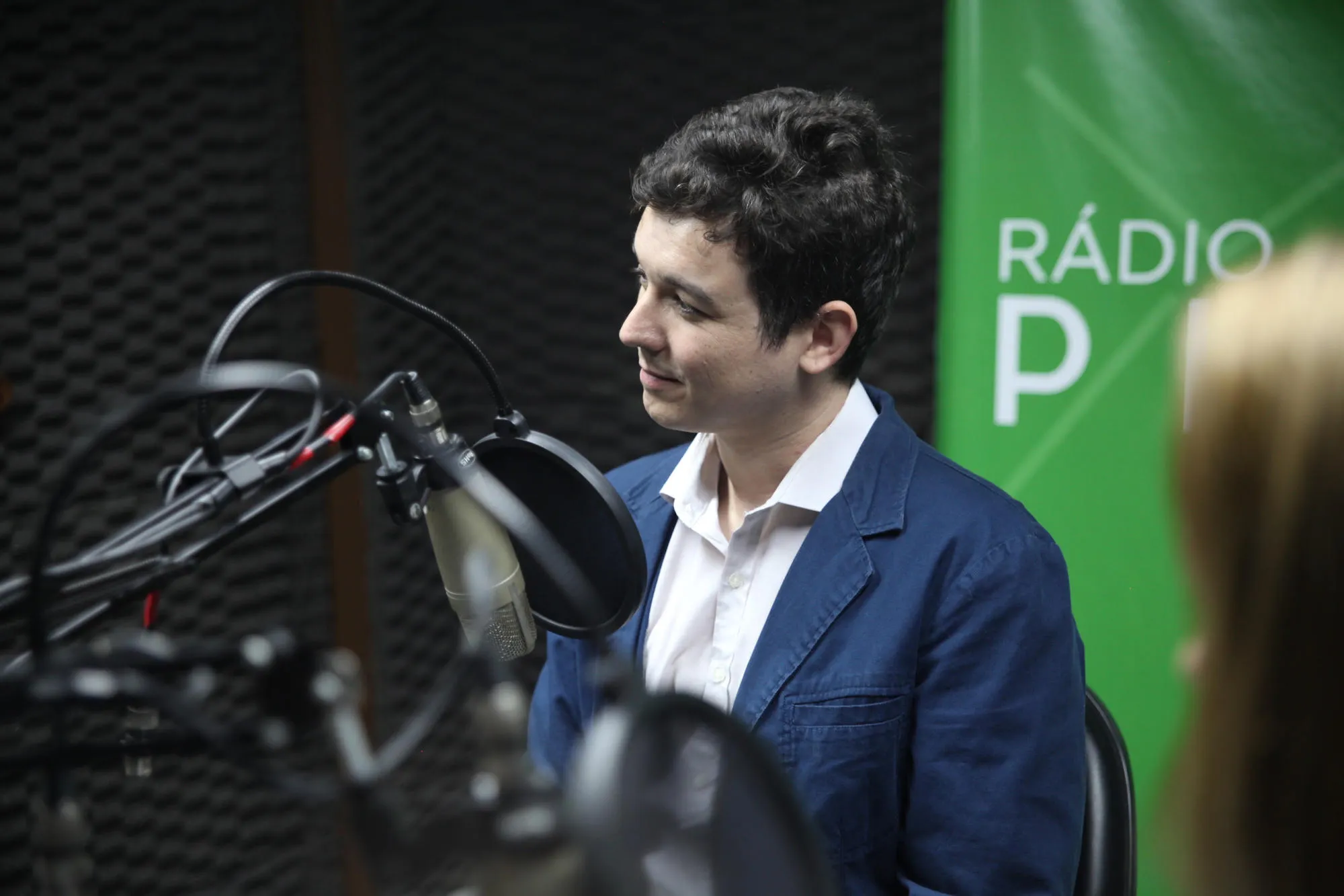Felipe Plets speaking during a radio interview